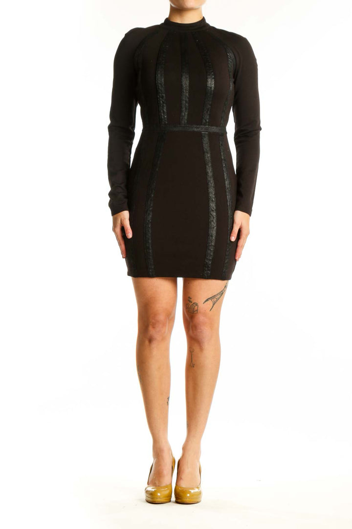 Black long sleeve bodycon dress with vertical lace panels by Bebe, front view