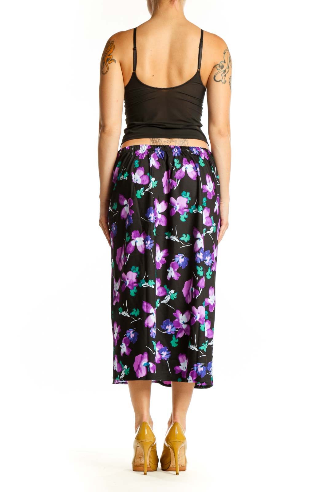 Black floral midi pencil skirt back view showing straight silhouette and vibrant botanical pattern