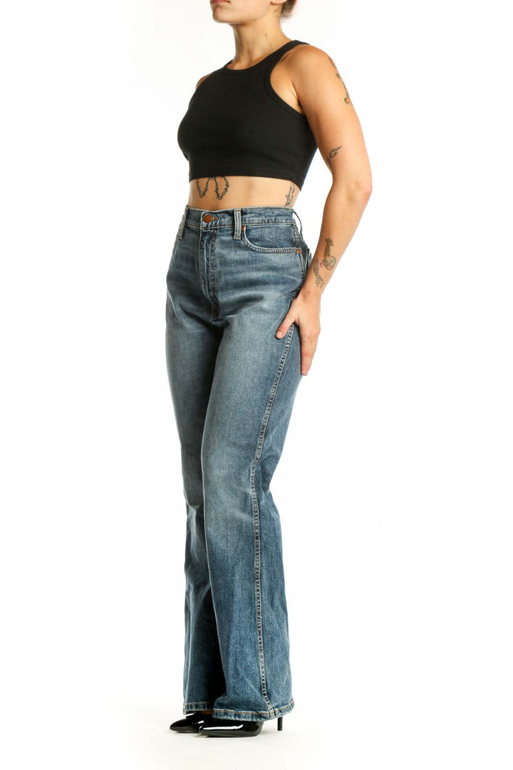 Front view of blue medium wash Wrangler flare jeans with high waist and five-pocket styling