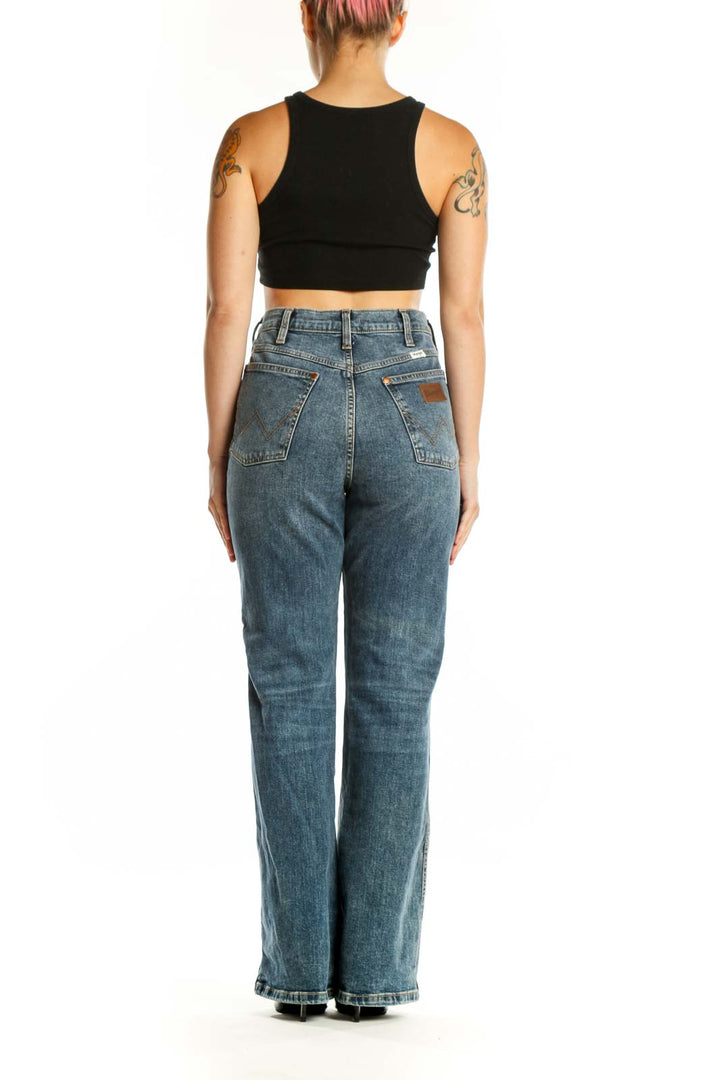 Back view of blue Wrangler flare jeans showing classic denim construction and flared leg silhouette