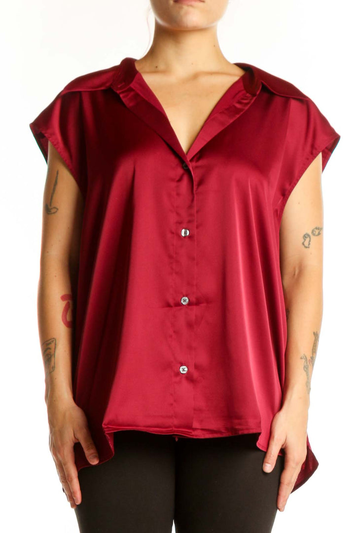 Burgundy button-up cap sleeve blouse with V-neckline, front view on model