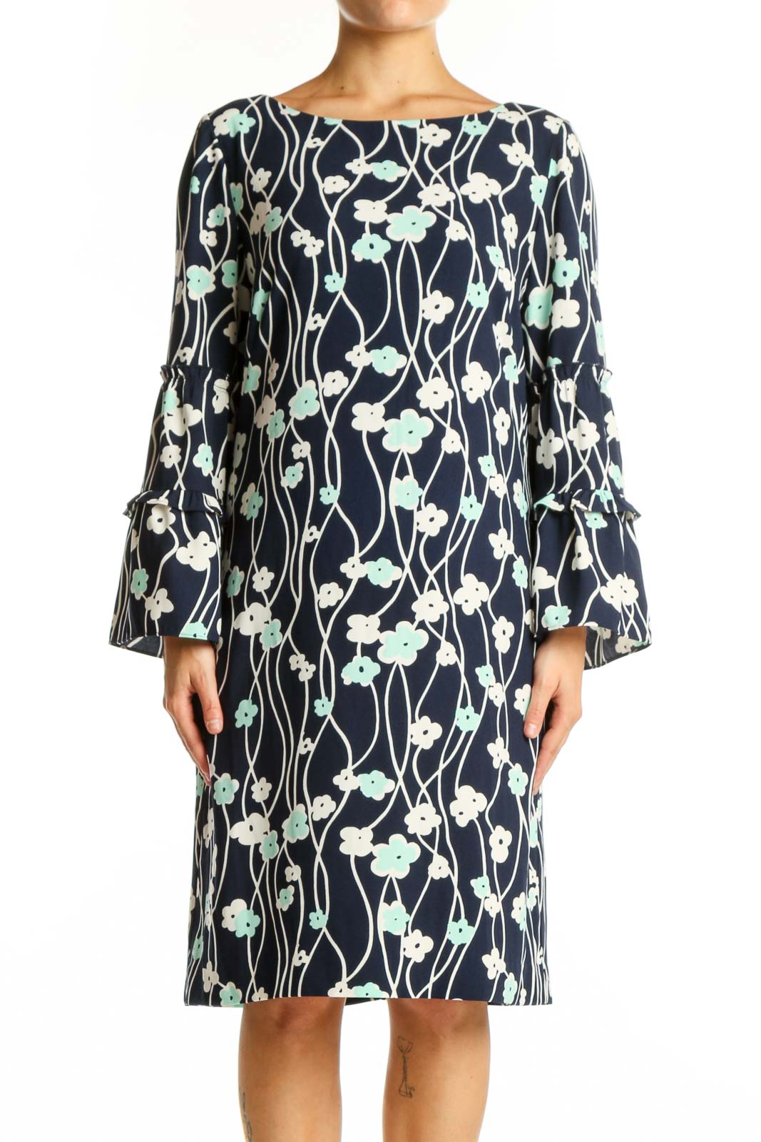 Navy floral canvas dress with bell sleeves and botanical print, front view on model