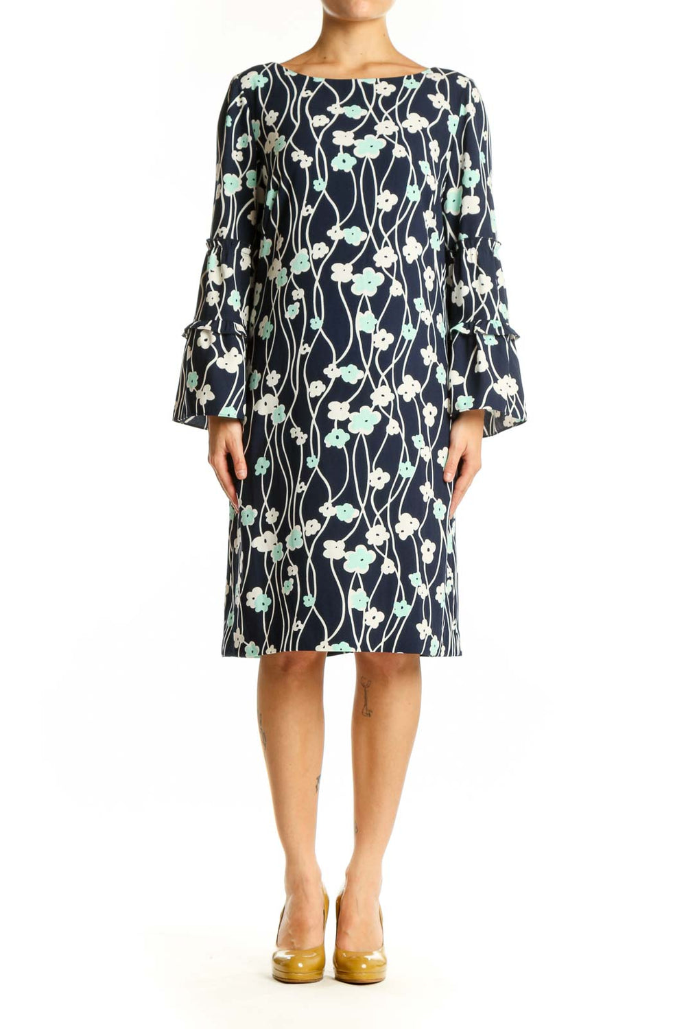 Navy floral canvas dress with bell sleeves and botanical print, front view on model