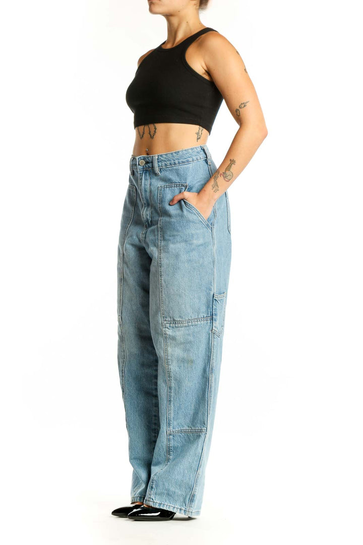 BLANKNYC light wash cargo denim jeans with functional pockets, front view on model