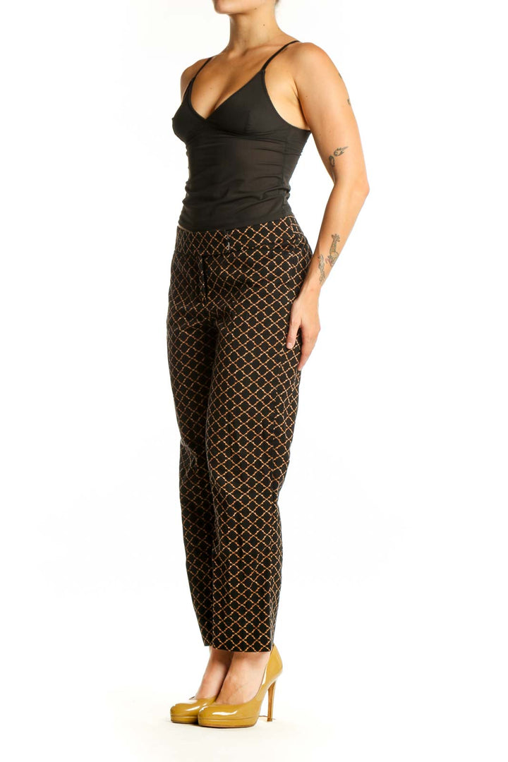 Black and gold geometric print straight leg pants front view