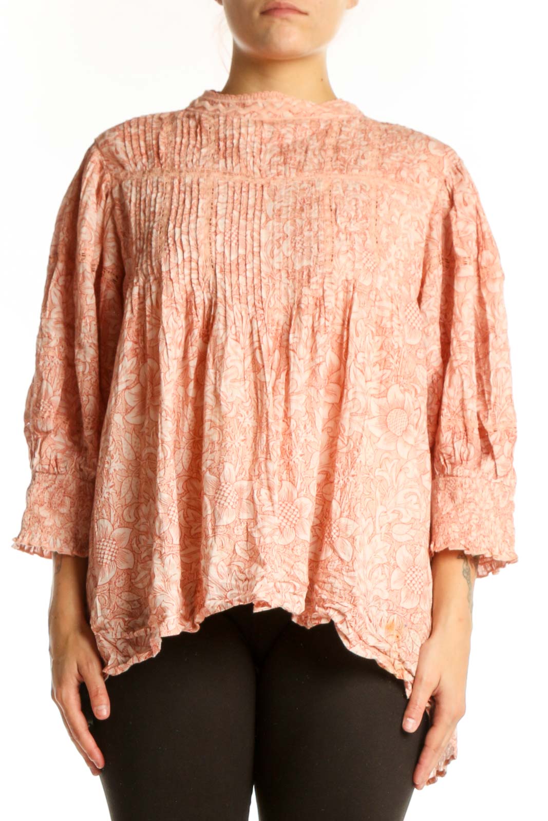Peach floral cotton blouse with pleated chest and puffed sleeves, front view on model