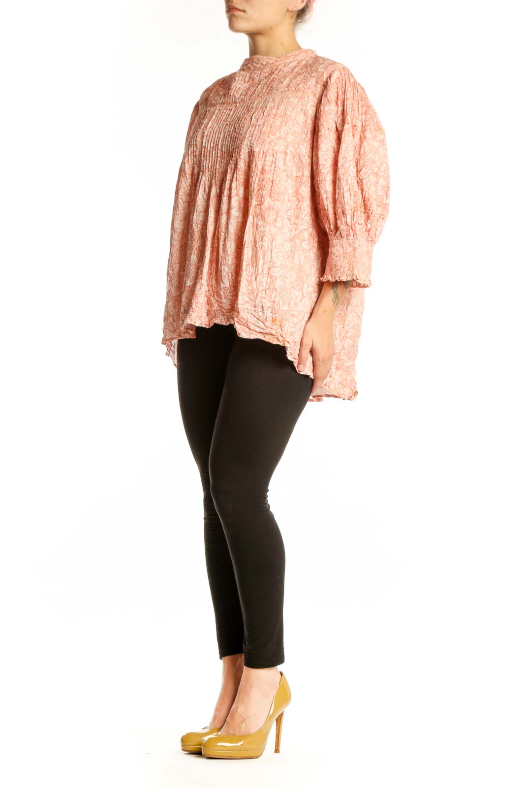 Peach floral cotton blouse with pleated chest and puffed sleeves, front view on model