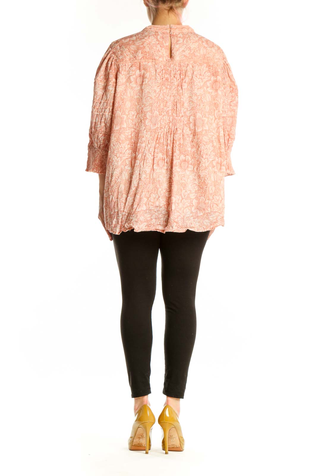 Peach floral cotton blouse with pleated back detail and asymmetrical hem, back view on model