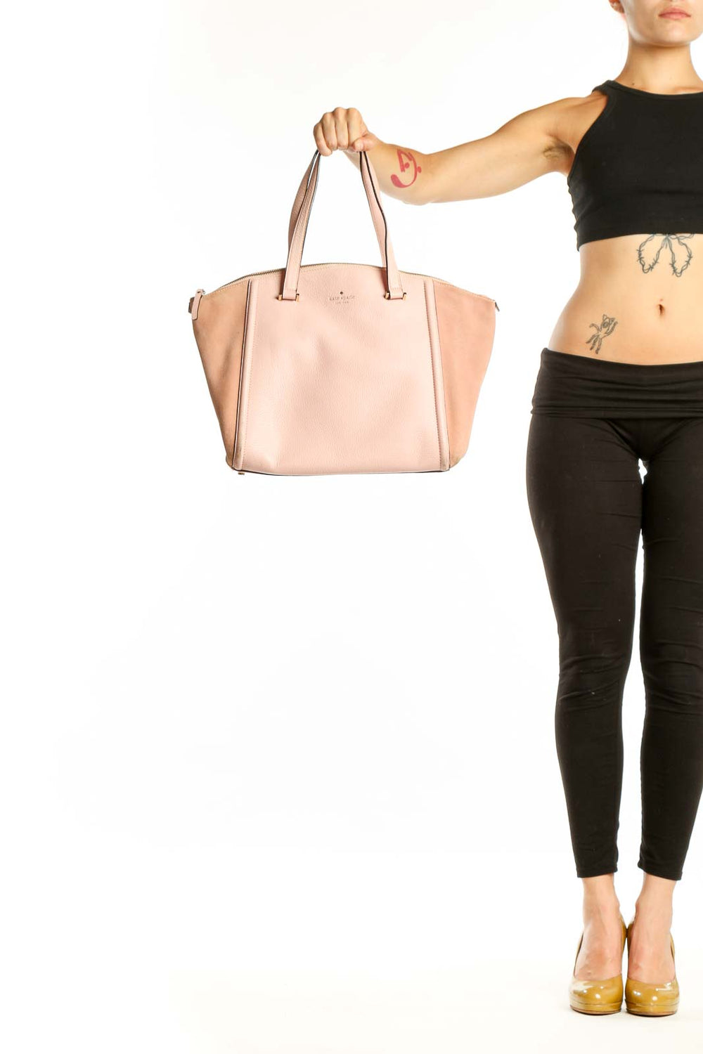 Blush pink leather Kate Spade tote bag with dual handles, front view