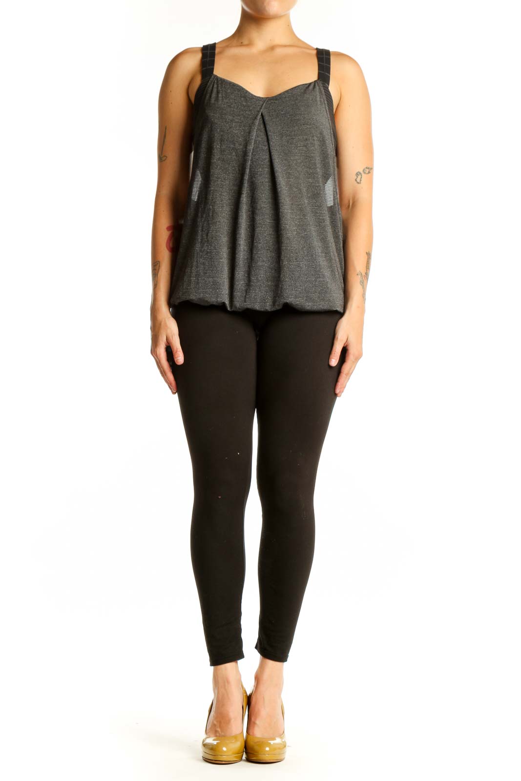 Charcoal gray Lululemon activewear tank with pleated front and sweetheart neckline, worn with black leggings