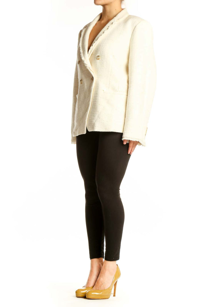 Cream double-breasted blazer with gold buttons and notch lapel collar, front view