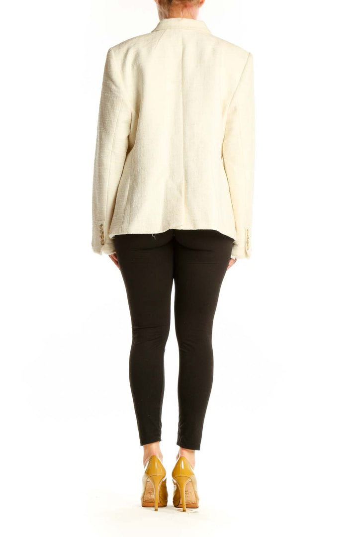 Cream double-breasted blazer with frayed edges, back view