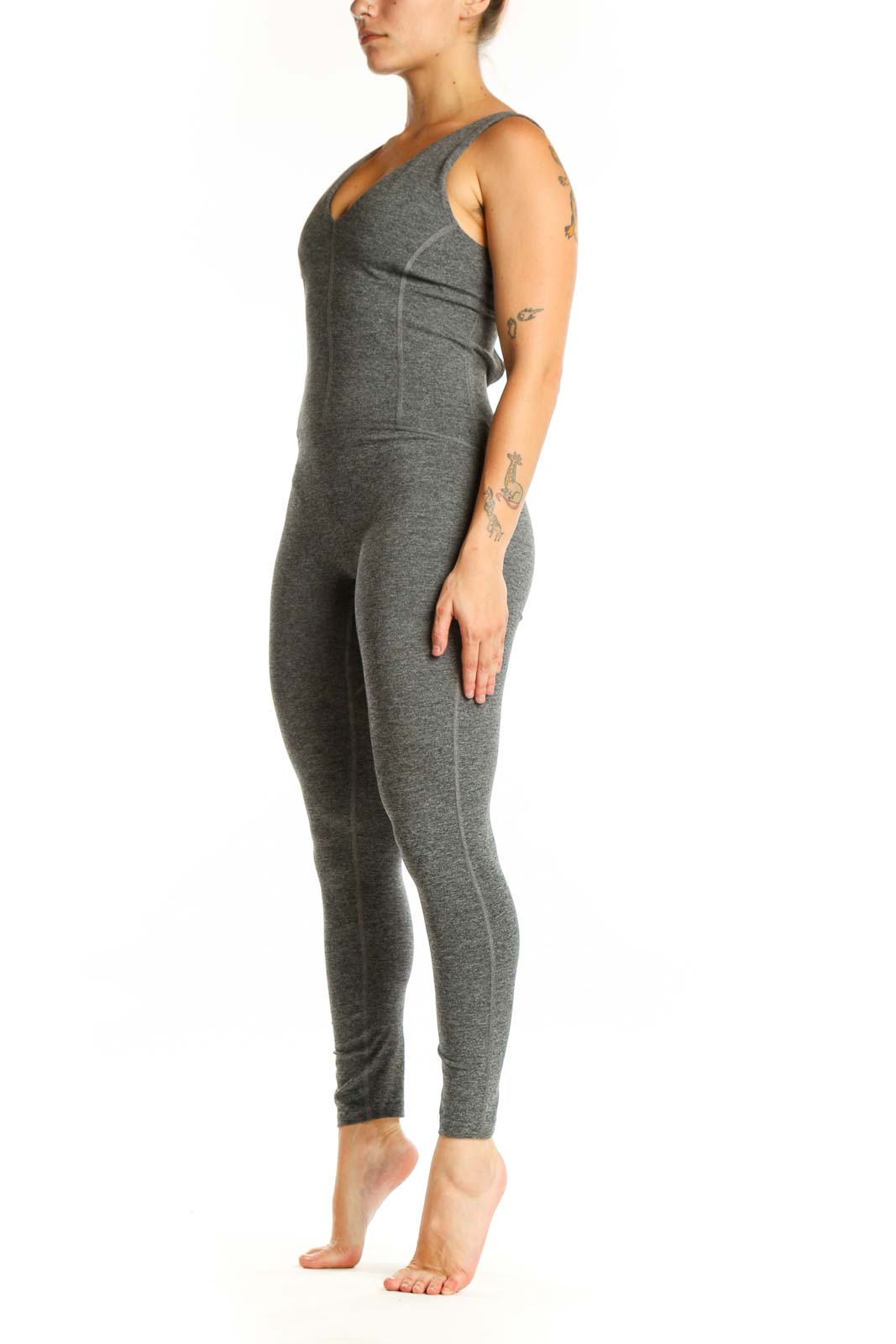 Gray V-neck sleeveless all-in-one jumpsuit front view on model, showing fitted silhouette and full-length design
