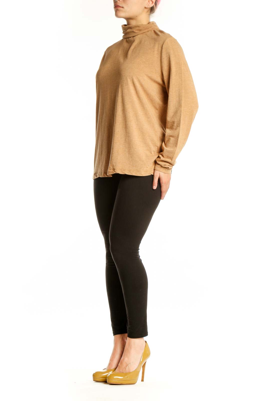 Woman wearing camel turtleneck long sleeve top with relaxed fit, front view