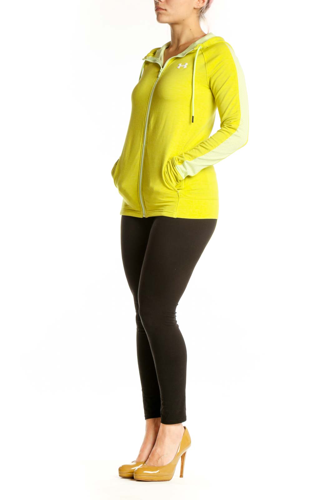 Woman wearing yellow Under Armour zip-up hoodie jacket with cream fleece-lined hood, front view
