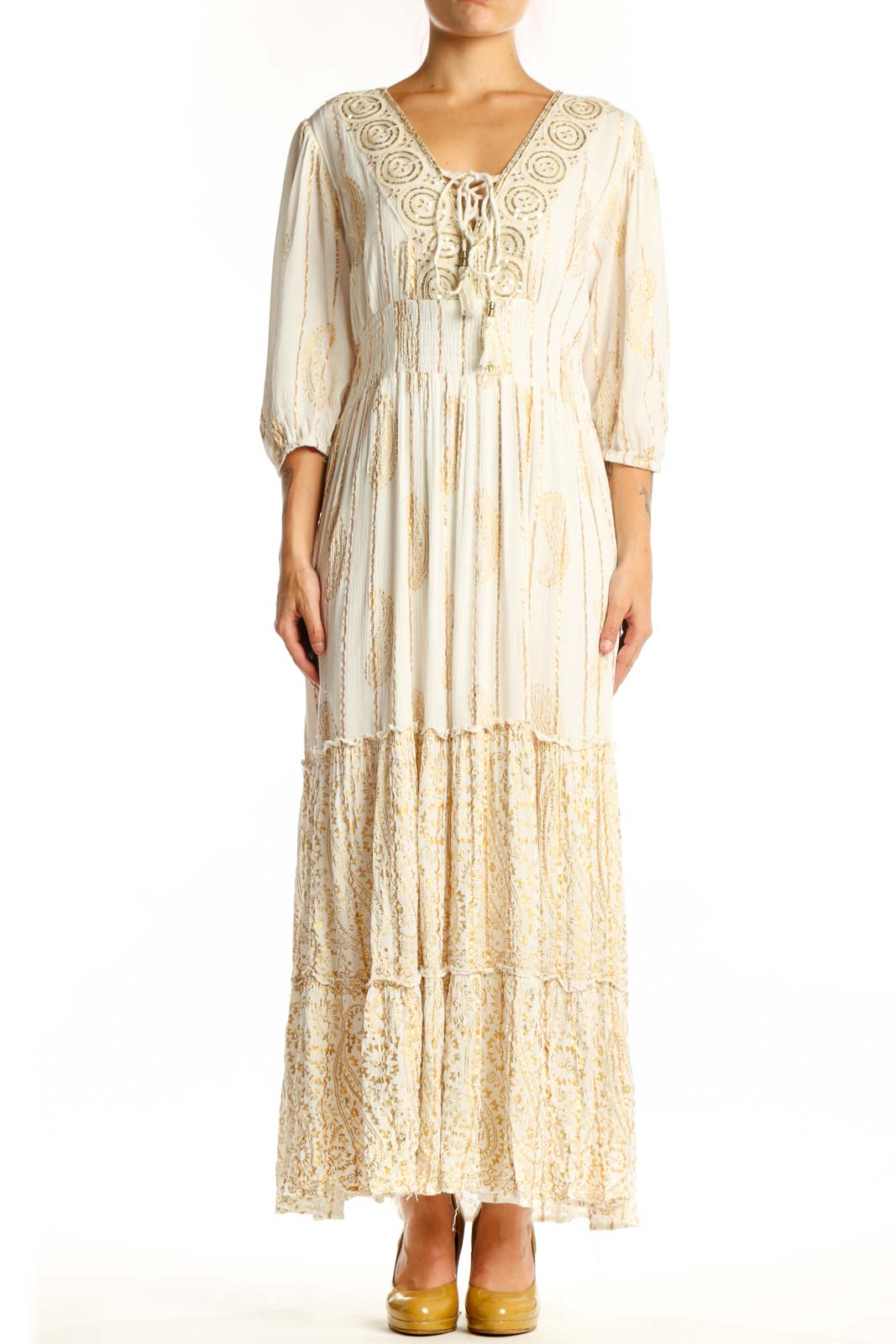 Front view of cream viscose maxi dress with embroidered V-neckline, three-quarter sleeves, and tiered lace hem