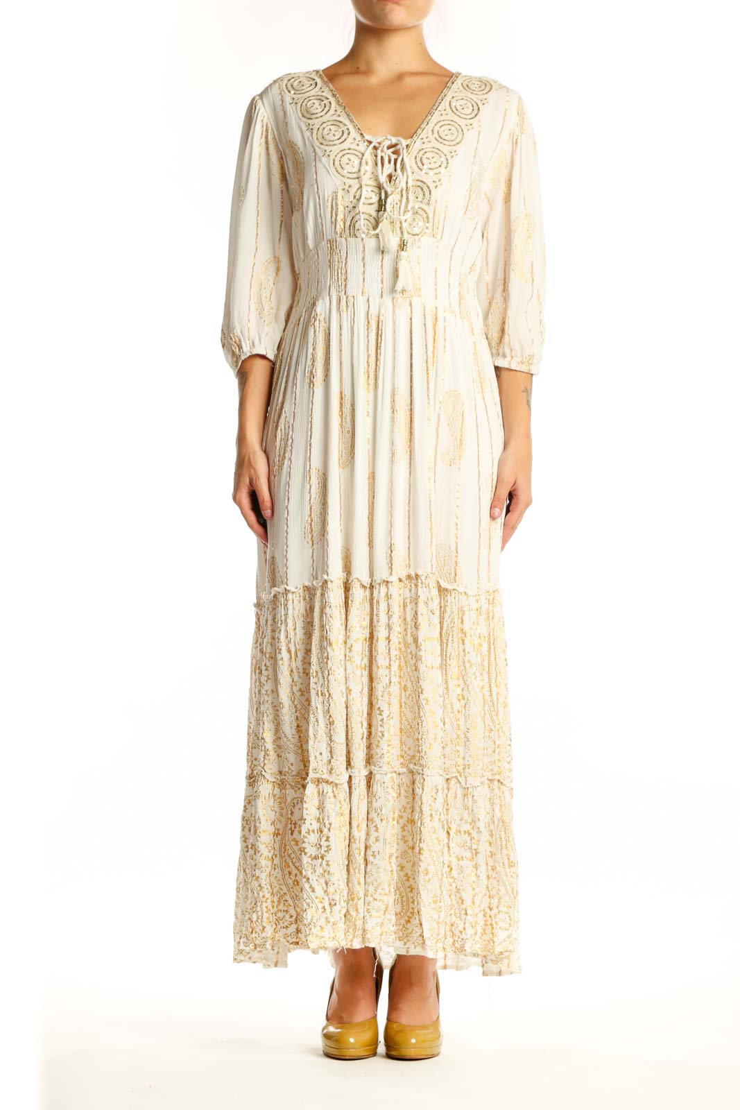 Front view of cream viscose maxi dress with embroidered V-neckline, three-quarter sleeves, and tiered lace hem