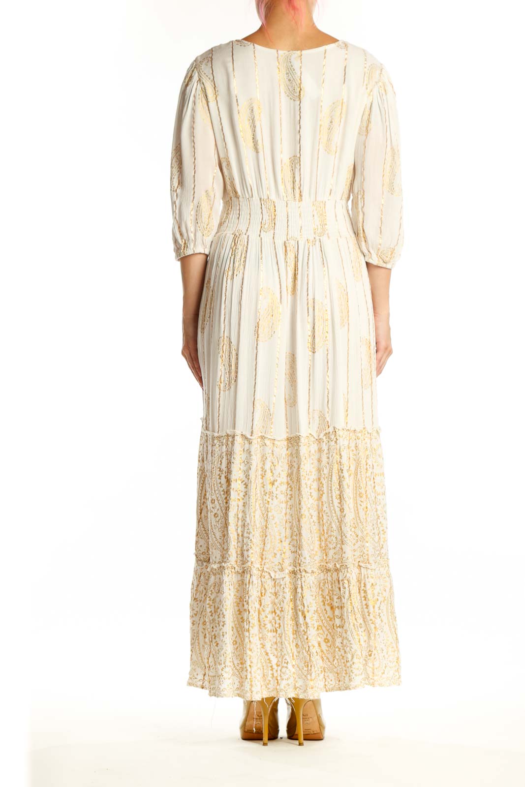 Back view of cream viscose maxi dress showing tie closure and flowing tiered lace panels