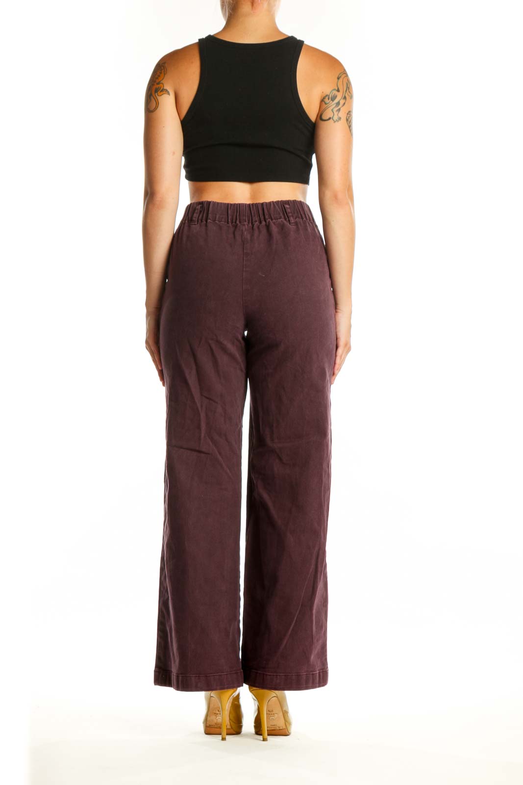 Back view of burgundy wide-leg pants showing relaxed fit through hip and thigh, demonstrating the comfortable and stylish cut of Young Fabulous & Broke design