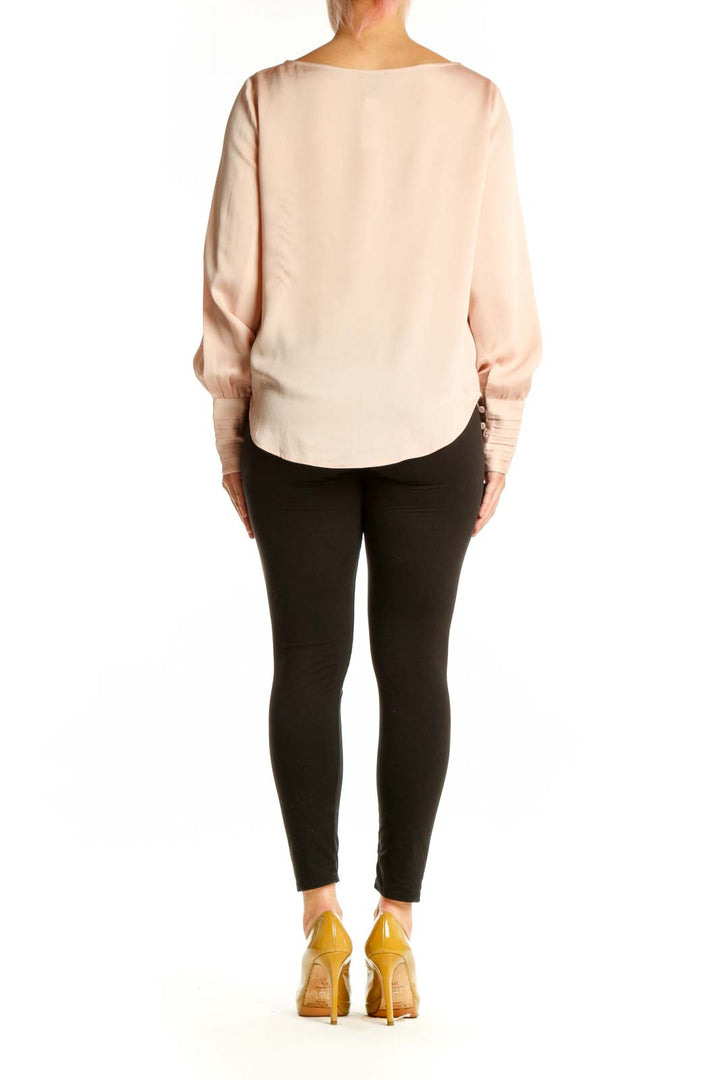 Ann Taylor cream polyester blouse with long sleeves and gathered cuffs, back view