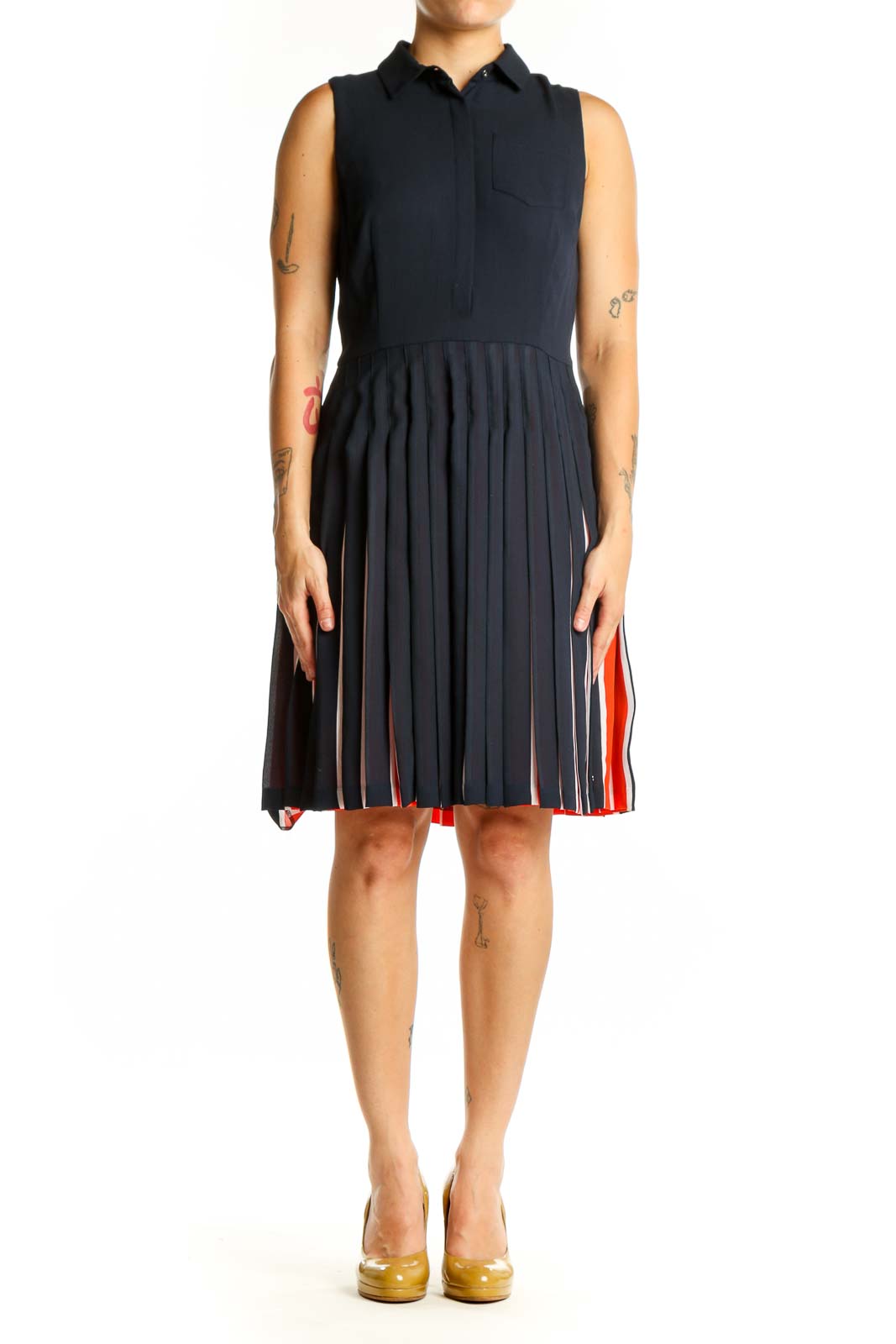 Navy sleeveless pleated shirt dress with red and white striped skirt detail, front view