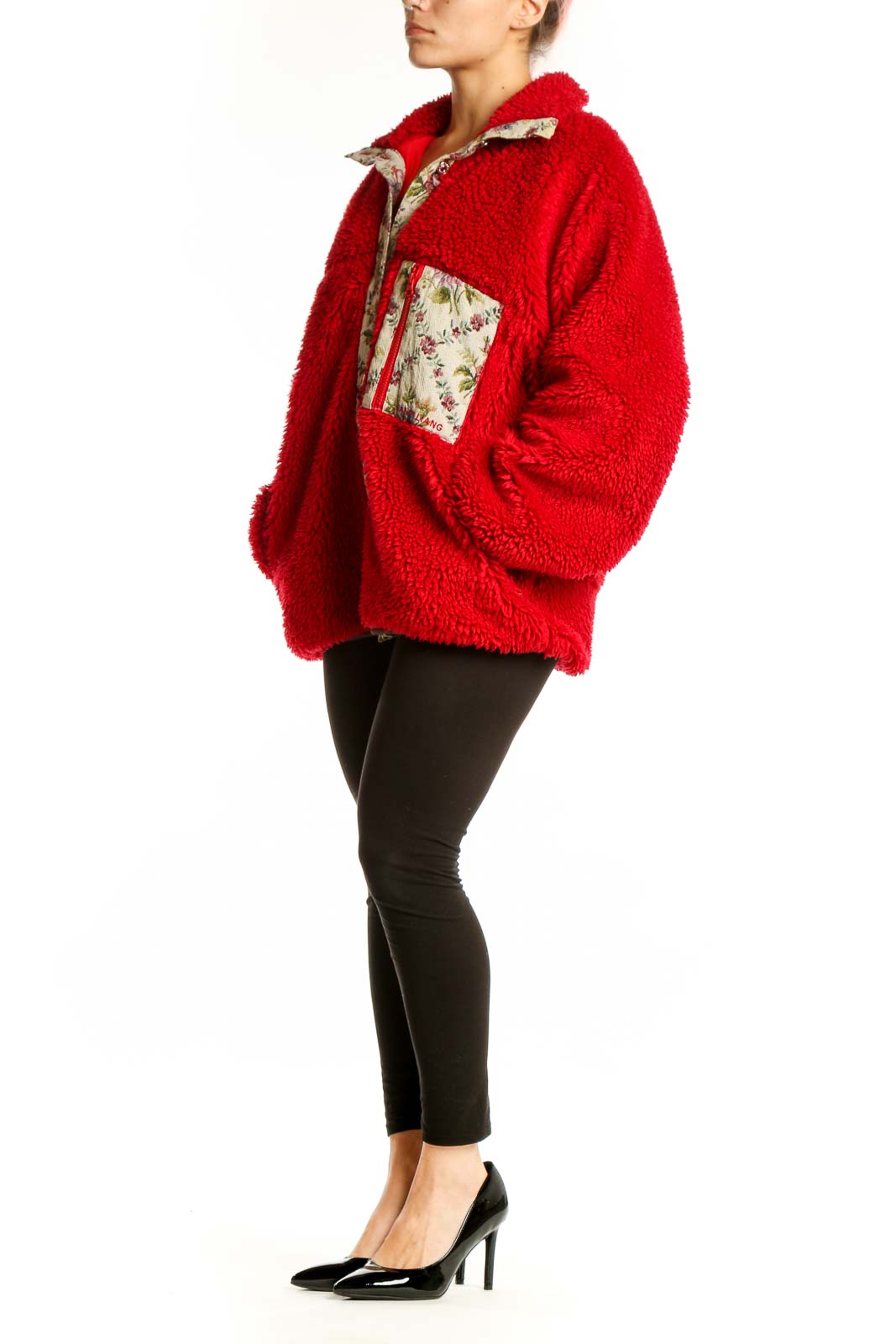 Red fuzzy zip-up jacket with floral-printed trim collar and pockets, worn with black leggings