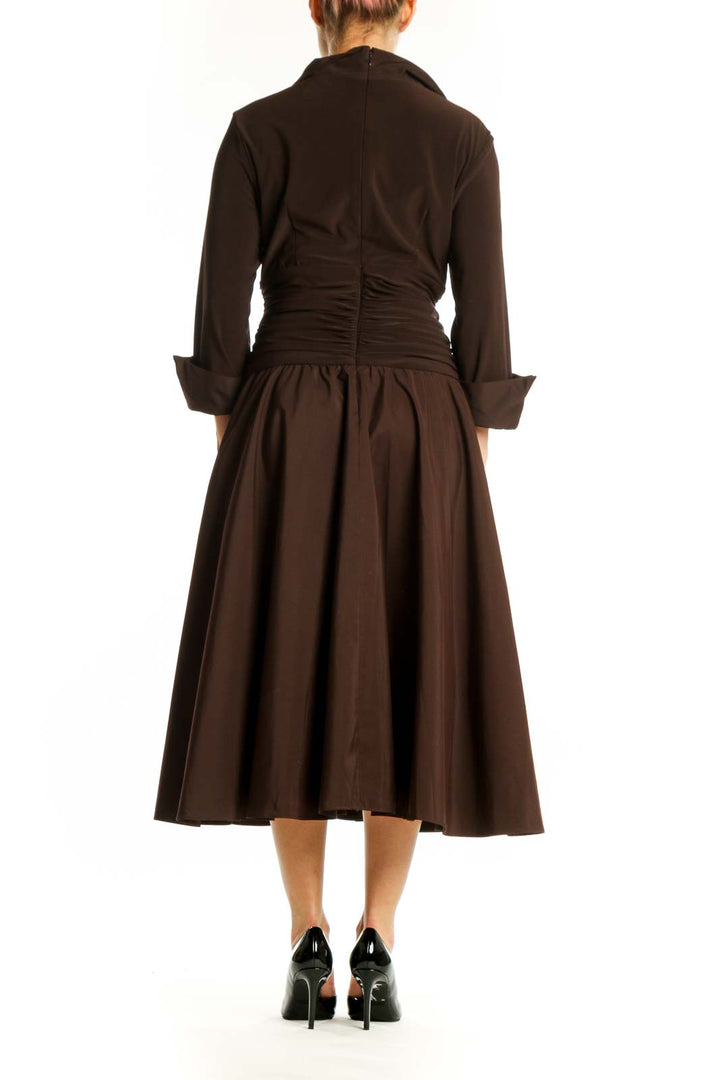 Back view of brown wrap midi dress showing ruched waist detail and flowing A-line skirt