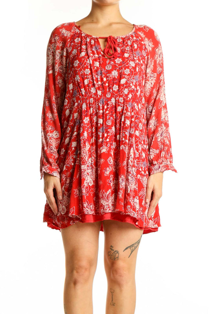 Red floral rayon tunic top with white print and keyhole neckline, front view