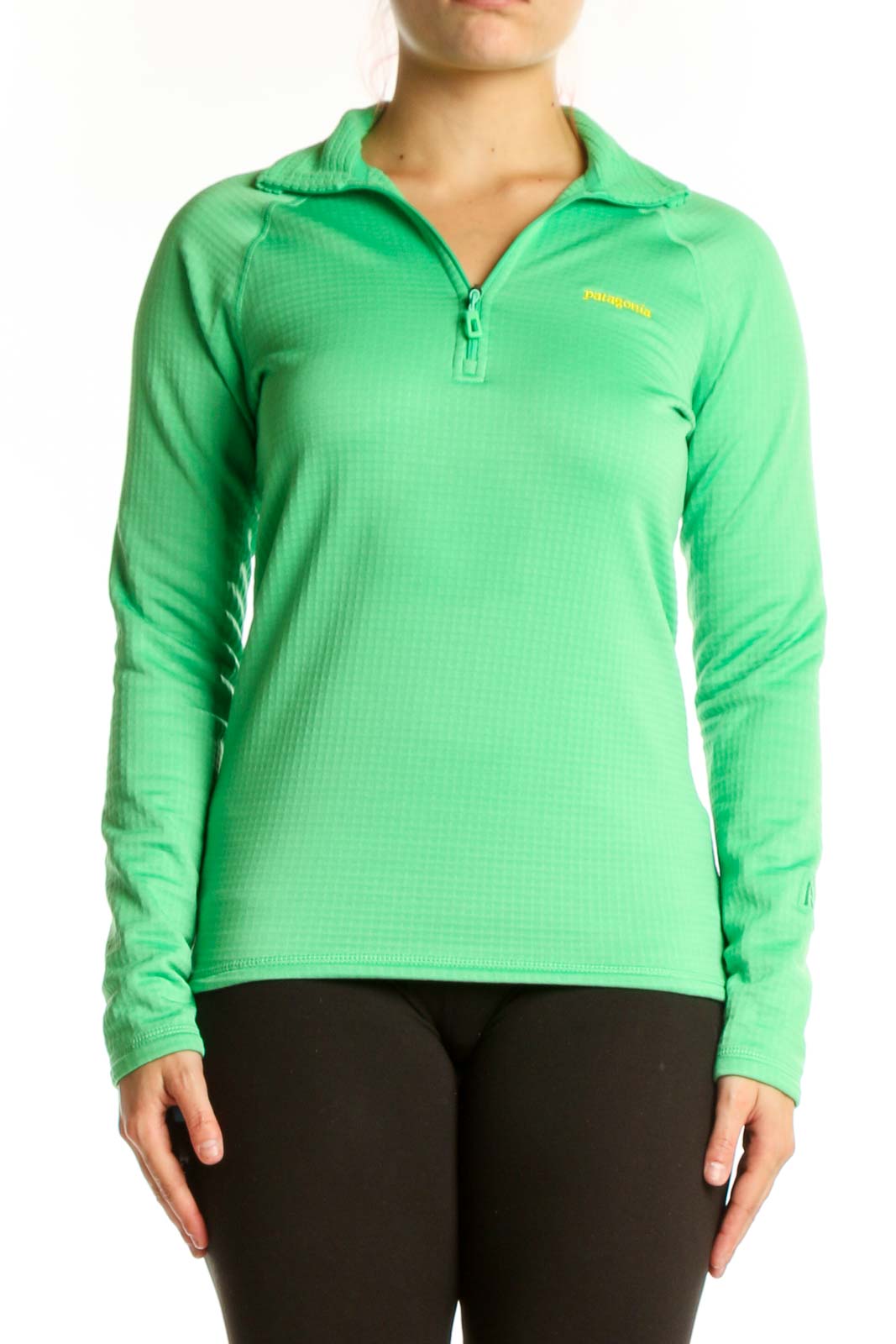 Green Patagonia quarter-zip long sleeve athletic top with yellow logo, front view on model