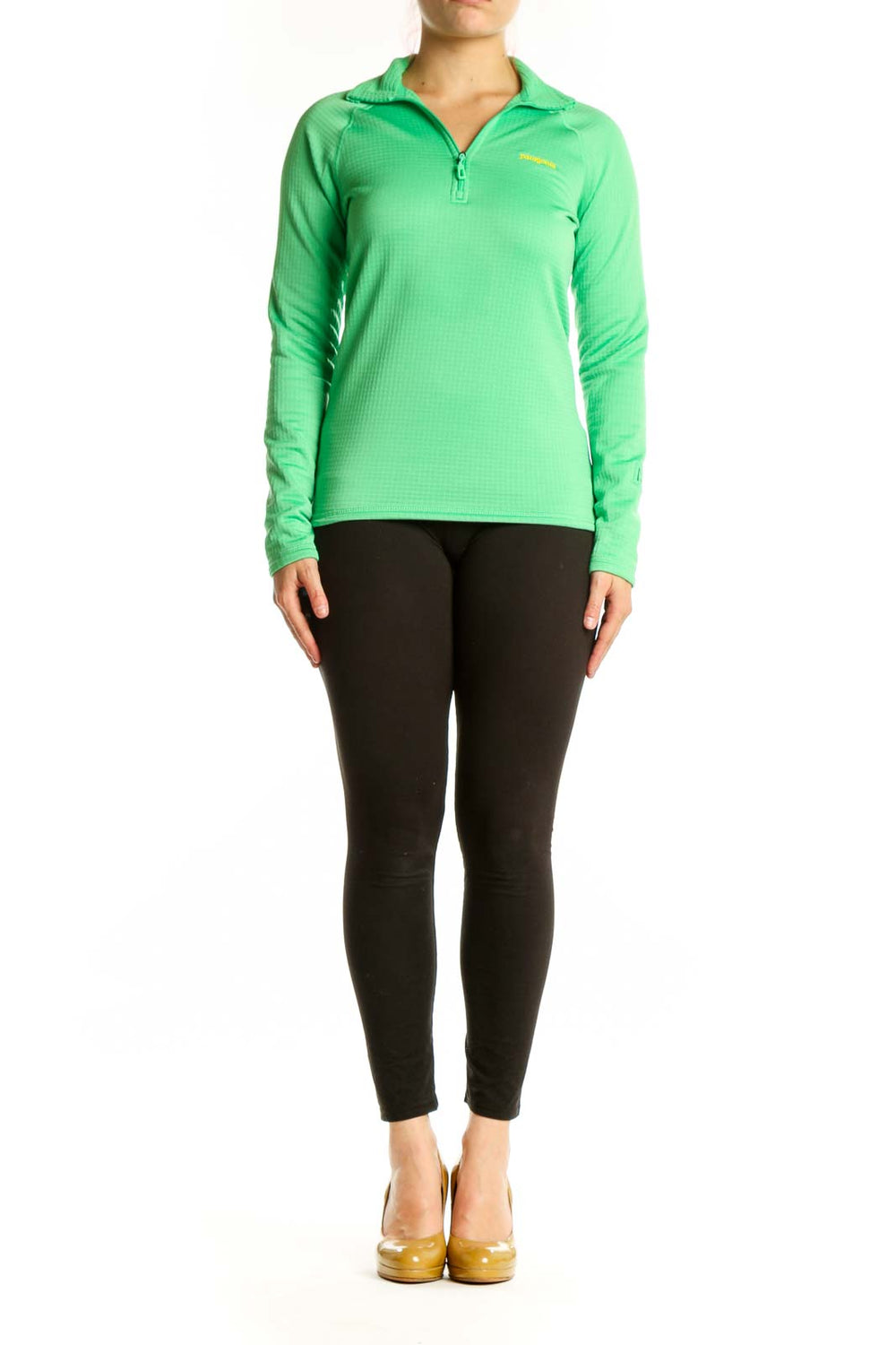 Green Patagonia quarter-zip long sleeve athletic top with yellow logo, front view on model