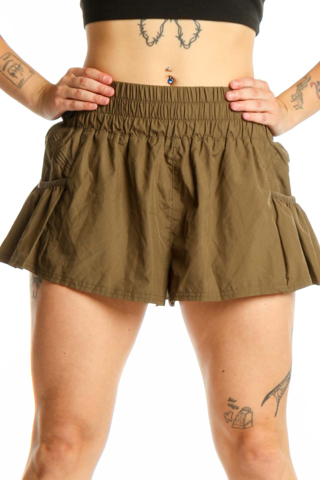 Olive green flared activewear shorts with elasticated waistband and side pockets, front view