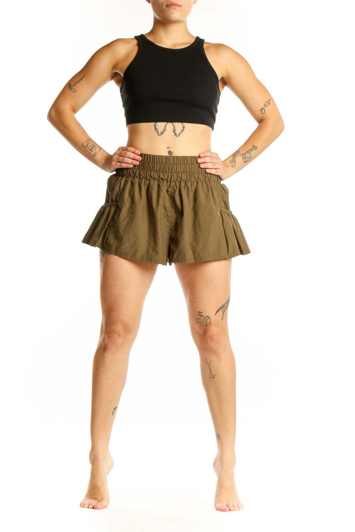 Olive green flared activewear shorts with elasticated waistband and side pockets, front view