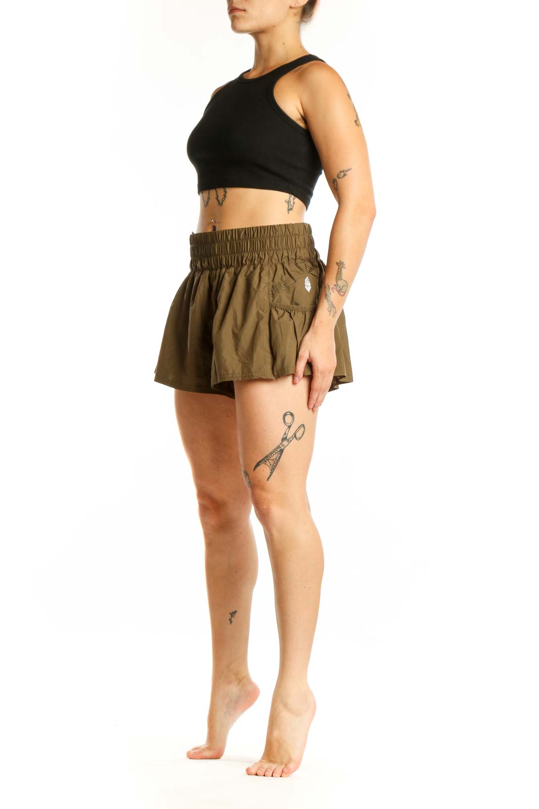 Olive green flared activewear shorts with elasticated waistband and side pockets, front view
