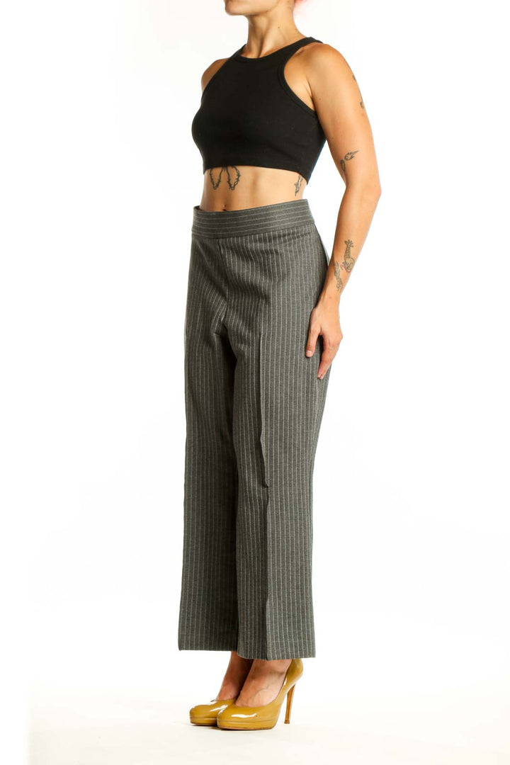 Front view of gray pinstriped cropped flare pants with high waistband and vertical stripe pattern