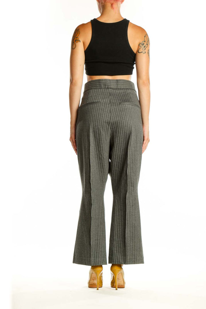 Back view of gray pinstriped cropped flare pants showing flattering fit and cropped ankle length