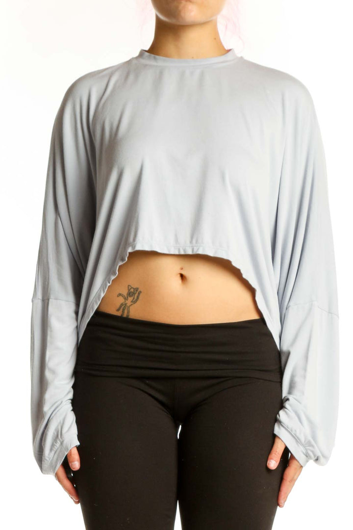 Gray cropped long sleeve top by Skims, front view showing relaxed fit and cropped silhouette