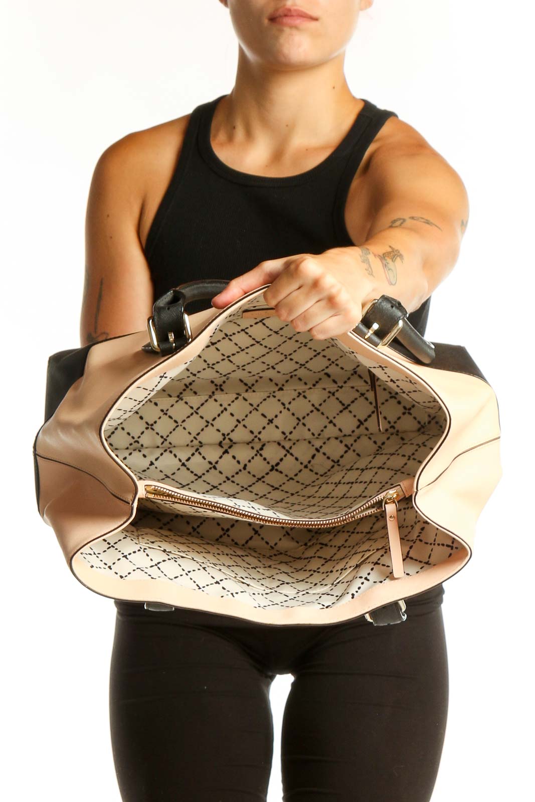 Kate Spade cream and black colorblock shoulder tote bag worn on shoulder, back view showing structured silhouette