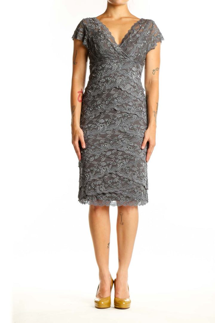 Gray lace wrap cocktail dress with flutter sleeves and ruched detailing, front view