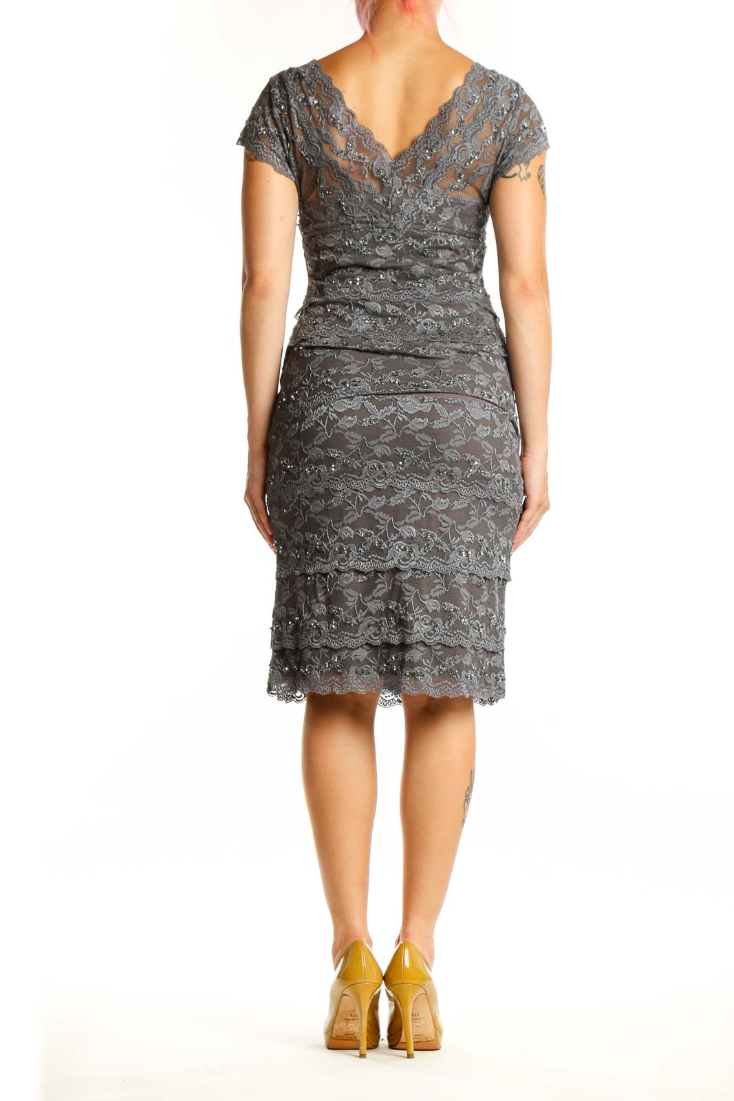 Gray lace wrap cocktail dress with flutter sleeves and ruched detailing, back view