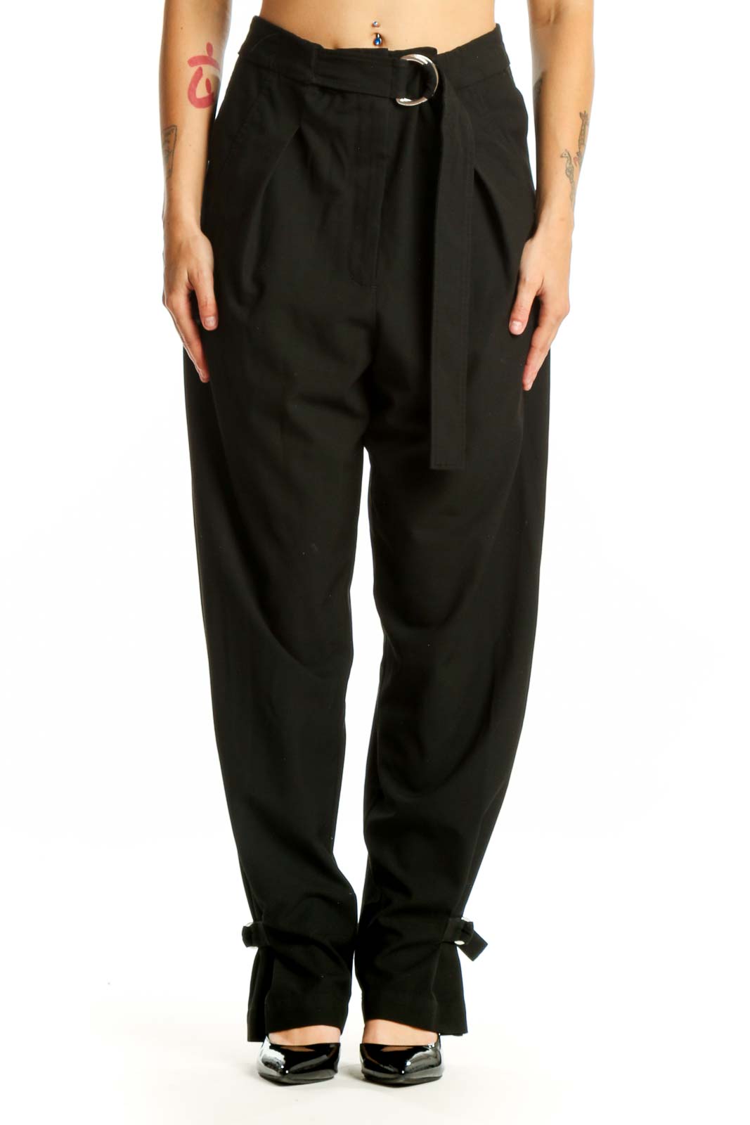 Black paperbag waist pants with tie belt and ankle bow detail, front view