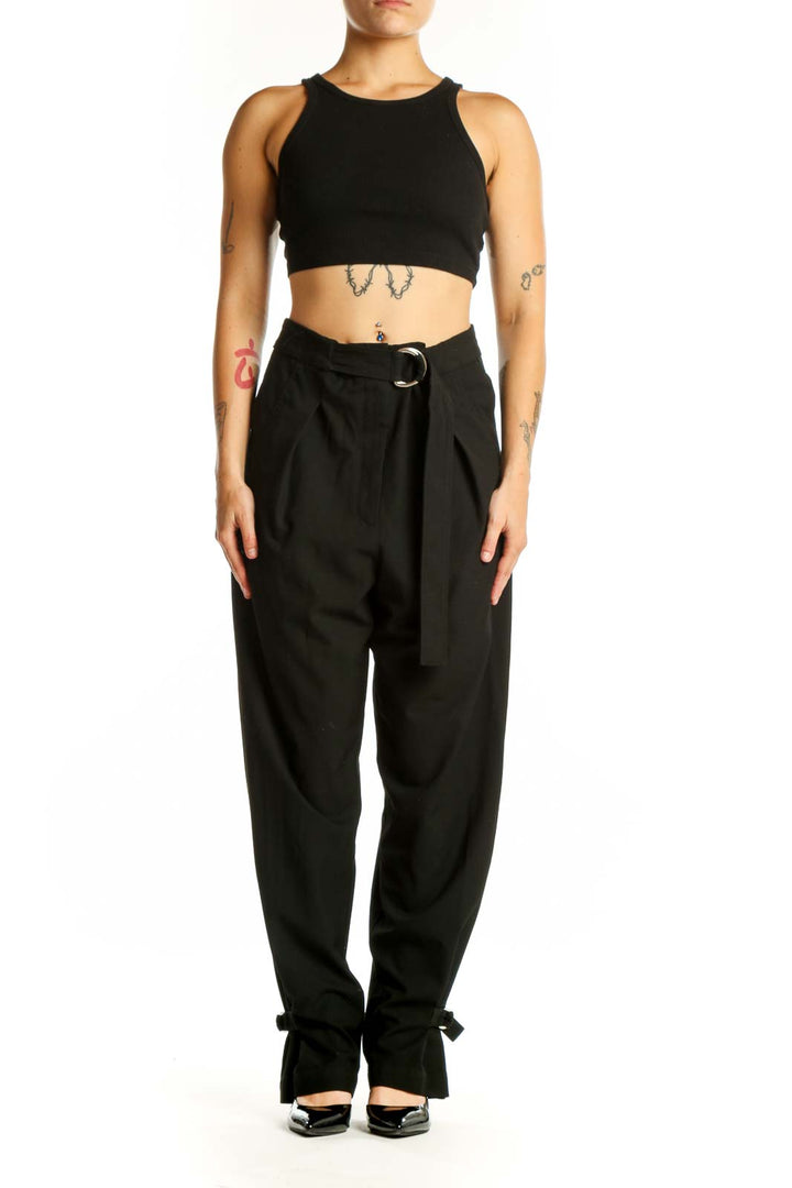 Black paperbag waist pants with tie belt and ankle bow detail, front view
