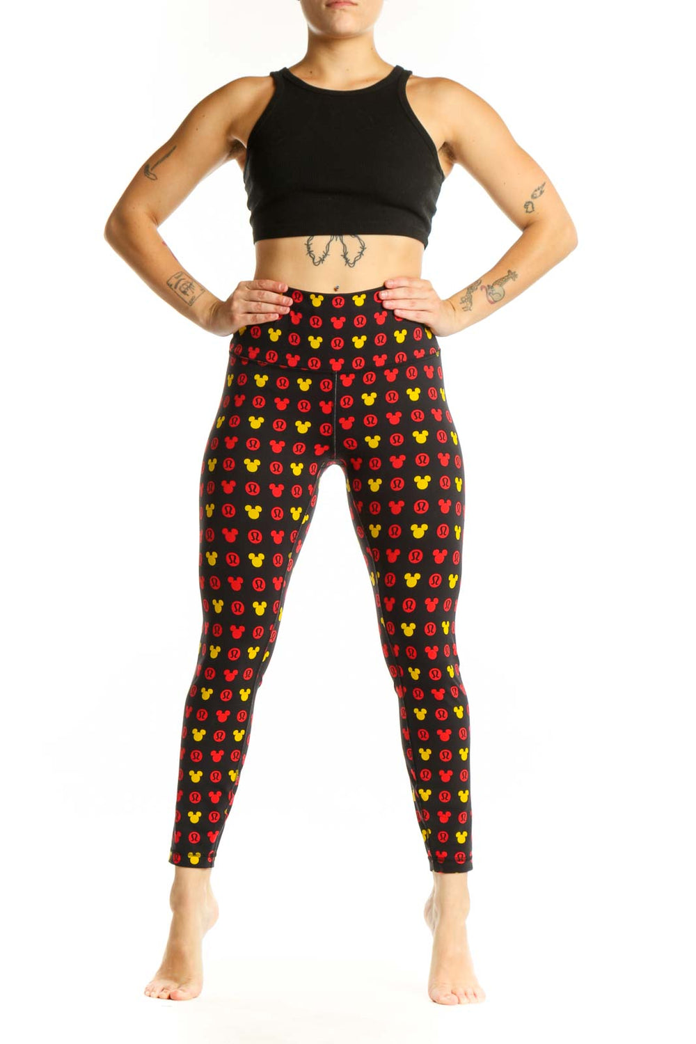 Front view of multicolor Mickey Mouse print Lululemon leggings in size S with high-waisted design
