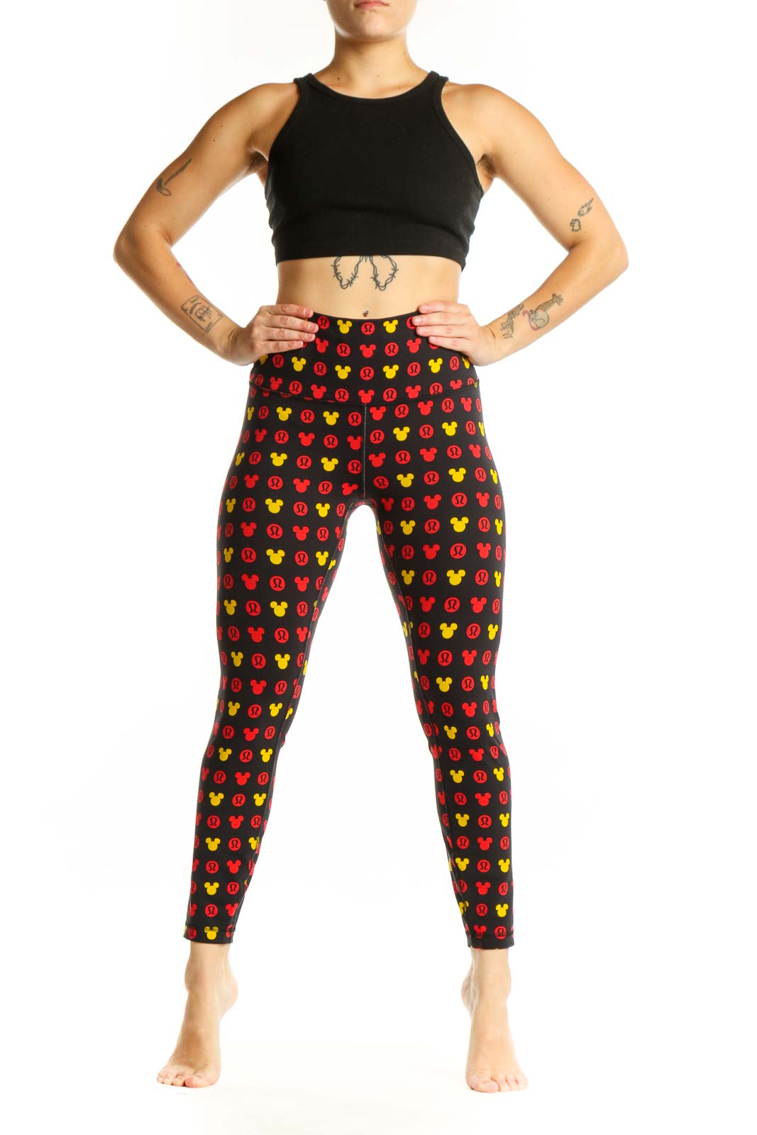 Front view of multicolor Mickey Mouse print Lululemon leggings in size S with high-waisted design