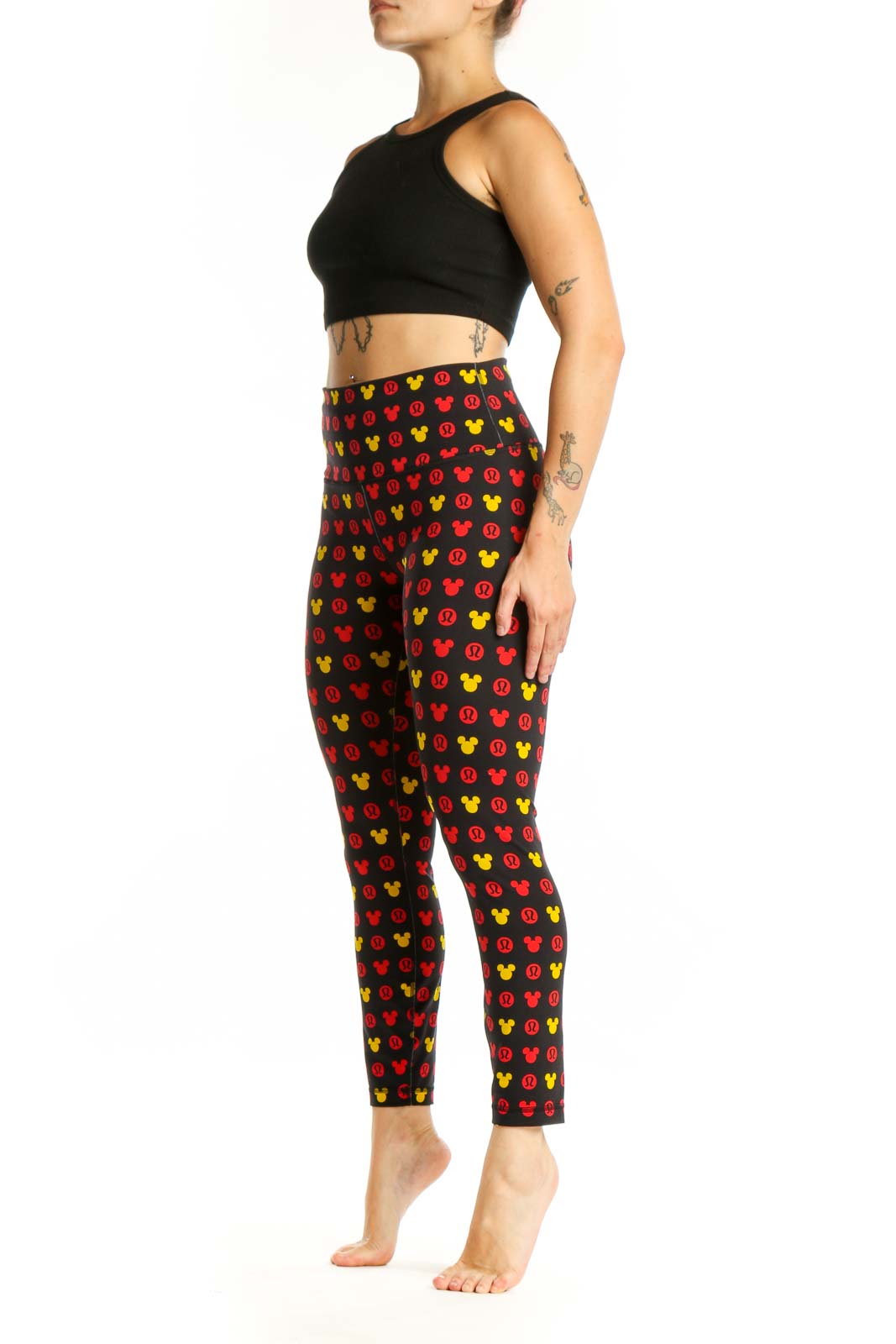 Front view of multicolor Mickey Mouse print Lululemon leggings in size S with high-waisted design