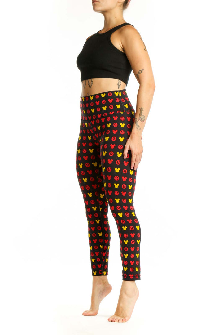 Front view of multicolor Mickey Mouse print Lululemon leggings in size S with high-waisted design