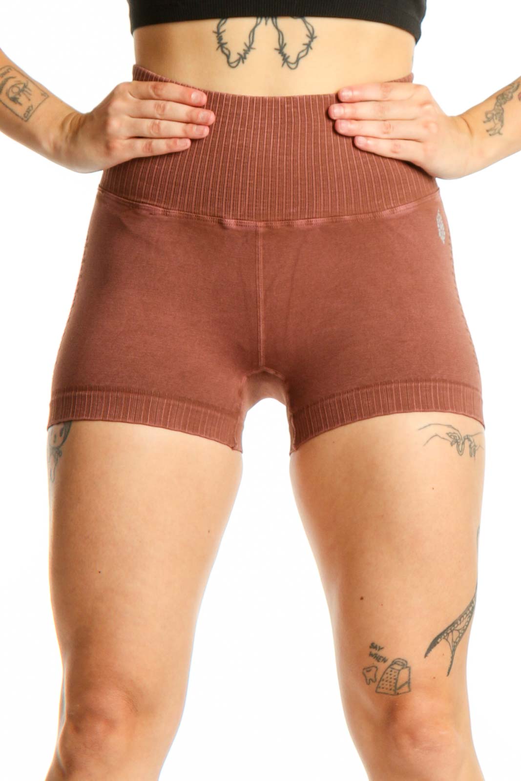 Rust ribbed high-waist activewear shorts front view, showing fitted silhouette and ribbed texture detail