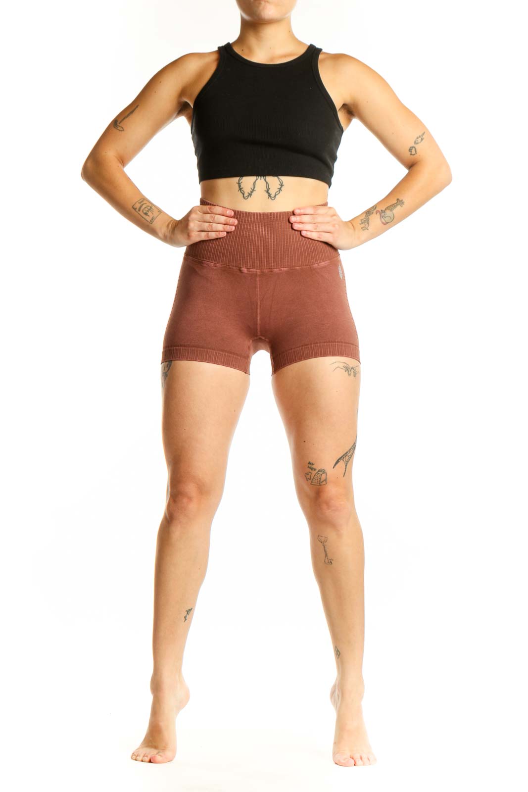 Rust ribbed high-waist activewear shorts front view, showing fitted silhouette and ribbed texture detail