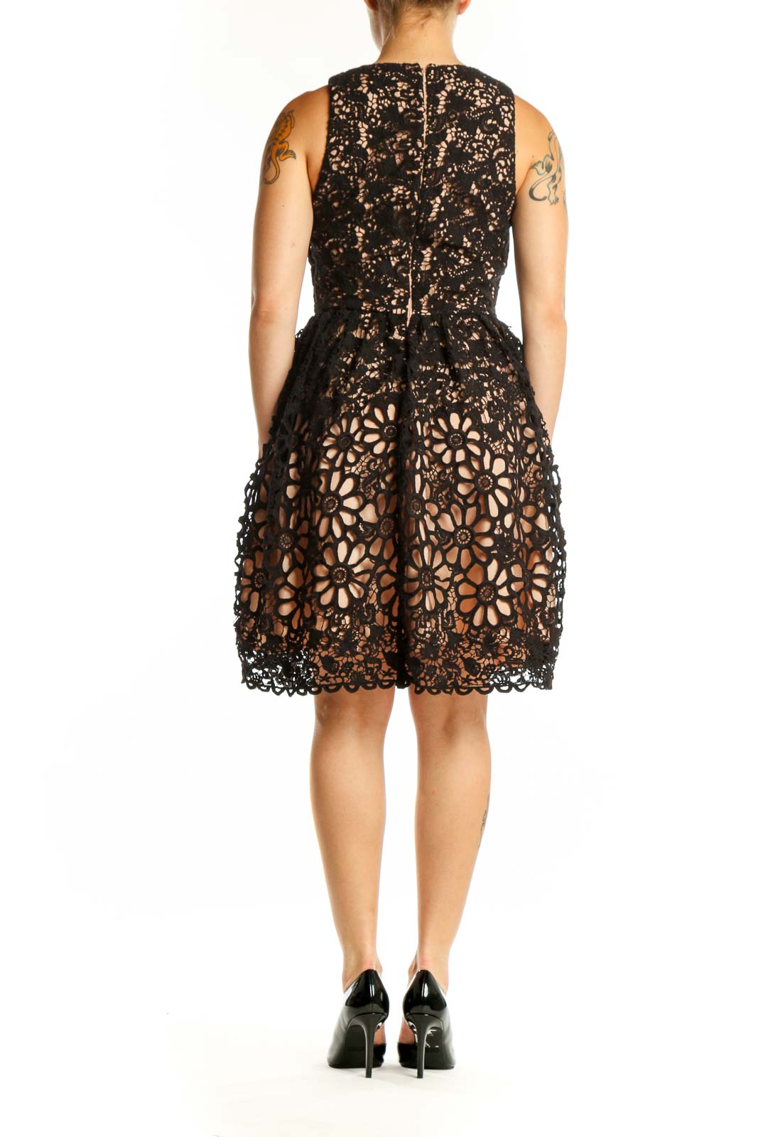 Black lace wrap dress with floral cutout details, back view showing sleeveless design