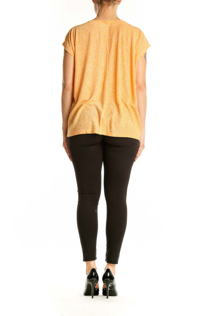 Gold striped V-neck short sleeve top from LOFT, size L, back view displaying the relaxed silhouette and striped pattern
