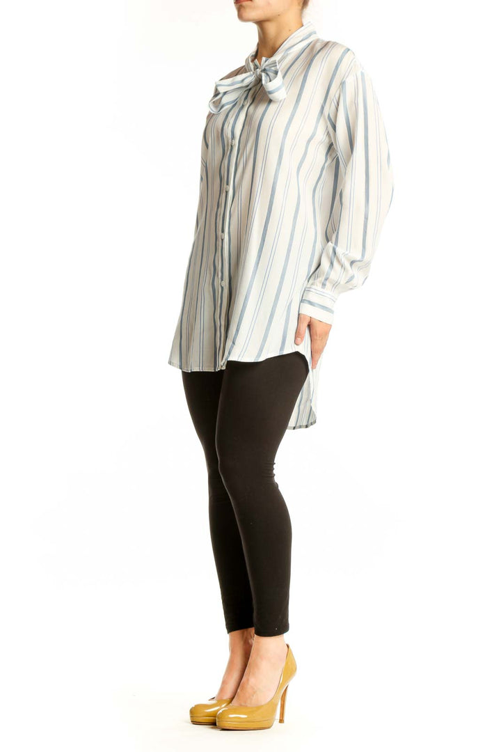 Cream and blue striped blouse with bow tie neckline by Elizabeth and James, front view